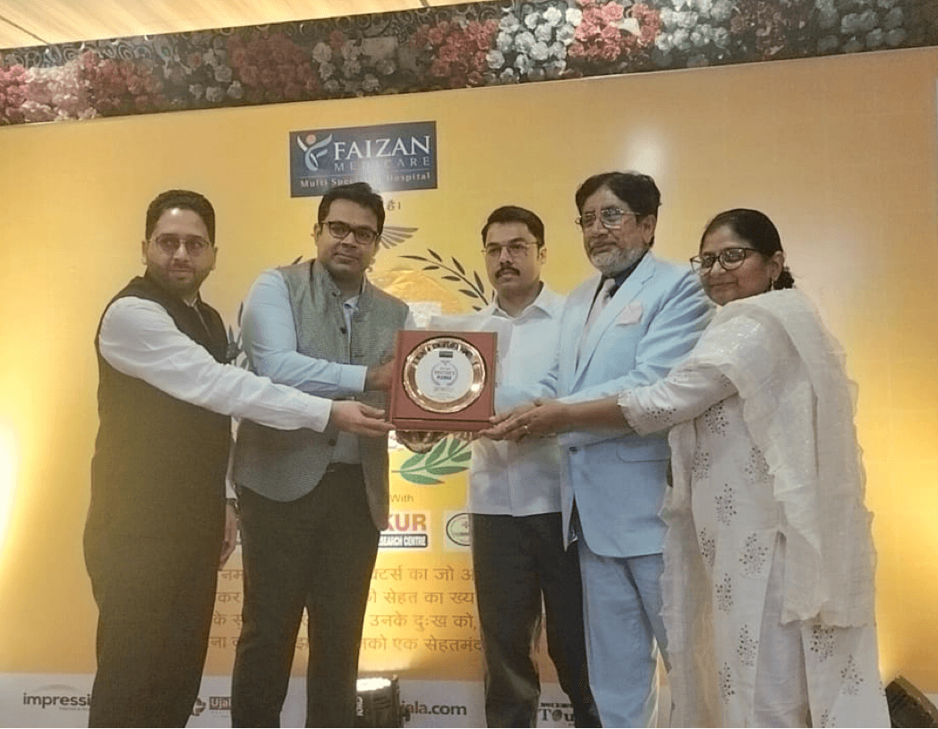 Commissioner Saharanpur, SSP Saharanpur, and CMO Saharanpur presenting the Award to Dr. Aslam and Dr. Safeena Tabassum for their contributions to the Medical Field in the region