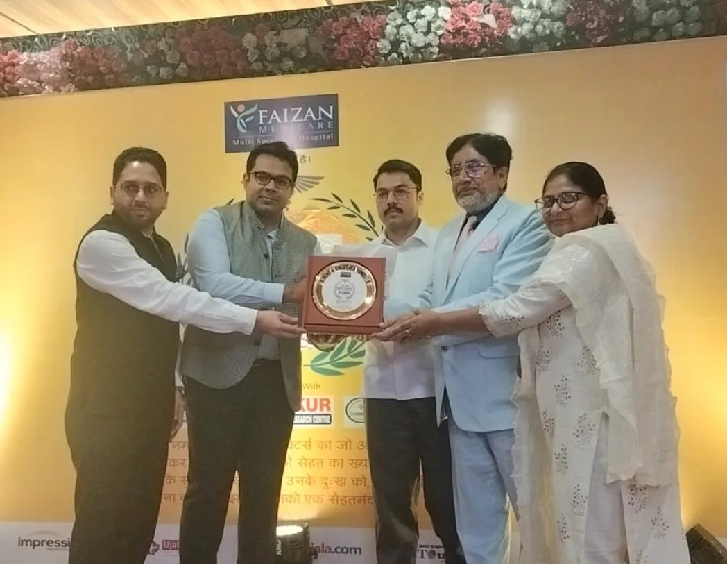 Commissioner Saharanpur, SSP Saharanpur, and CMO Saharanpur presenting the Award to Dr. Aslam and Dr. Safeena Tabassum for their contributions to the Medical Field in the region